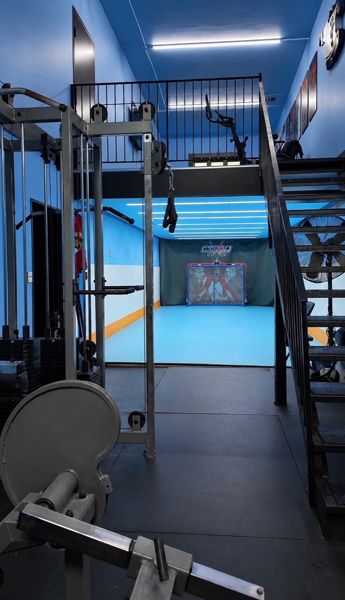 The 905PUCK warehouse: gym floor looking through to the shooting lane