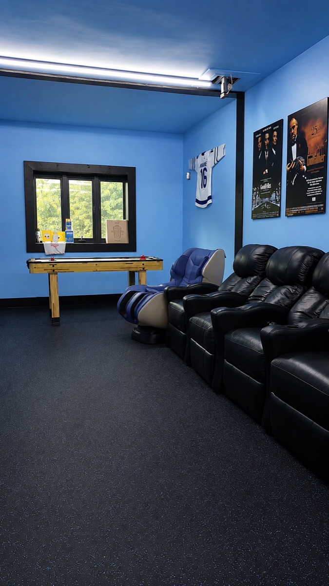 The recovery room: massage chair, theatre seating and air hockey